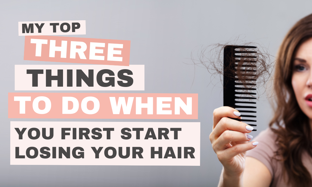 women holding a comb covered in hair.