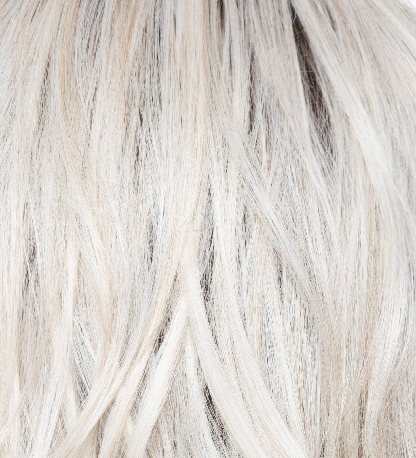 Close-up of blonde hair with a gradient from light to dark.