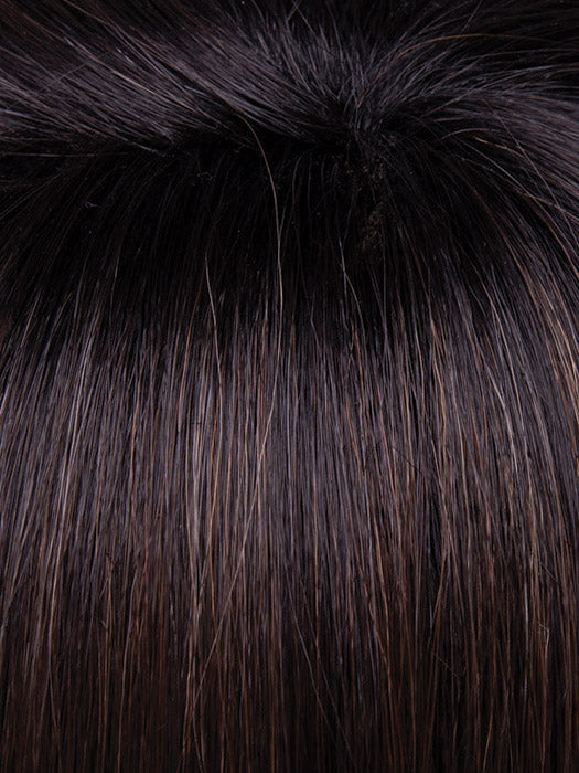 Close-up of dark brown hair with a fluffy black fur collar.