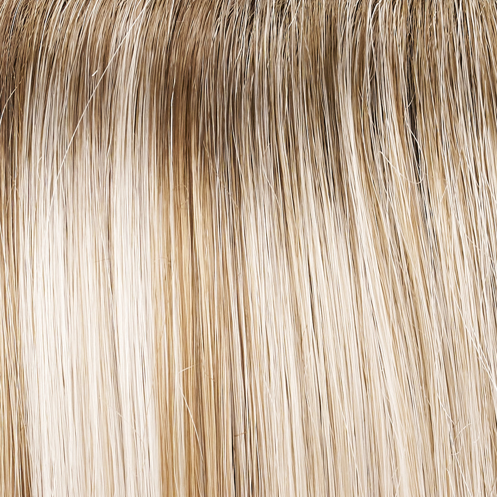 Close-up of blonde hair extensions with a gradient from light to dark.