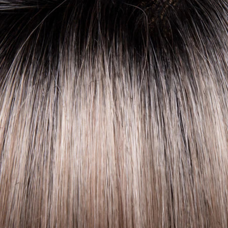 Close-up of hair with brown and blonde color gradient on a black background