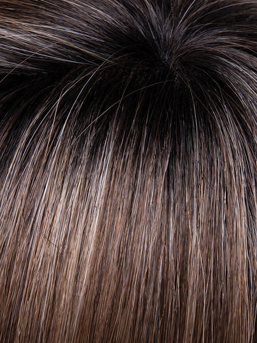 Close-up of dark brown hair with a gradient to black at the roots.