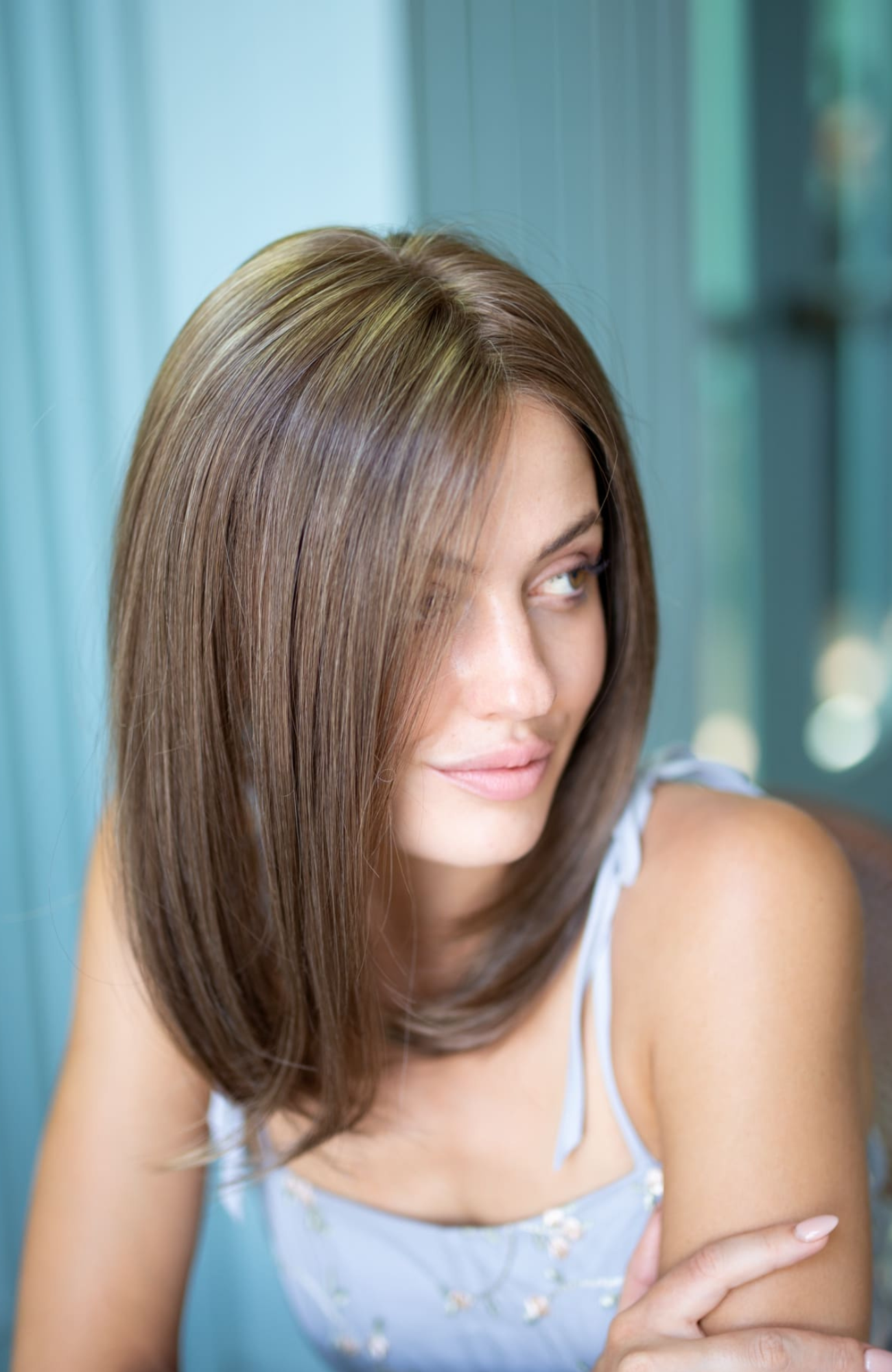Woman with a stylish haircut against a blurred background