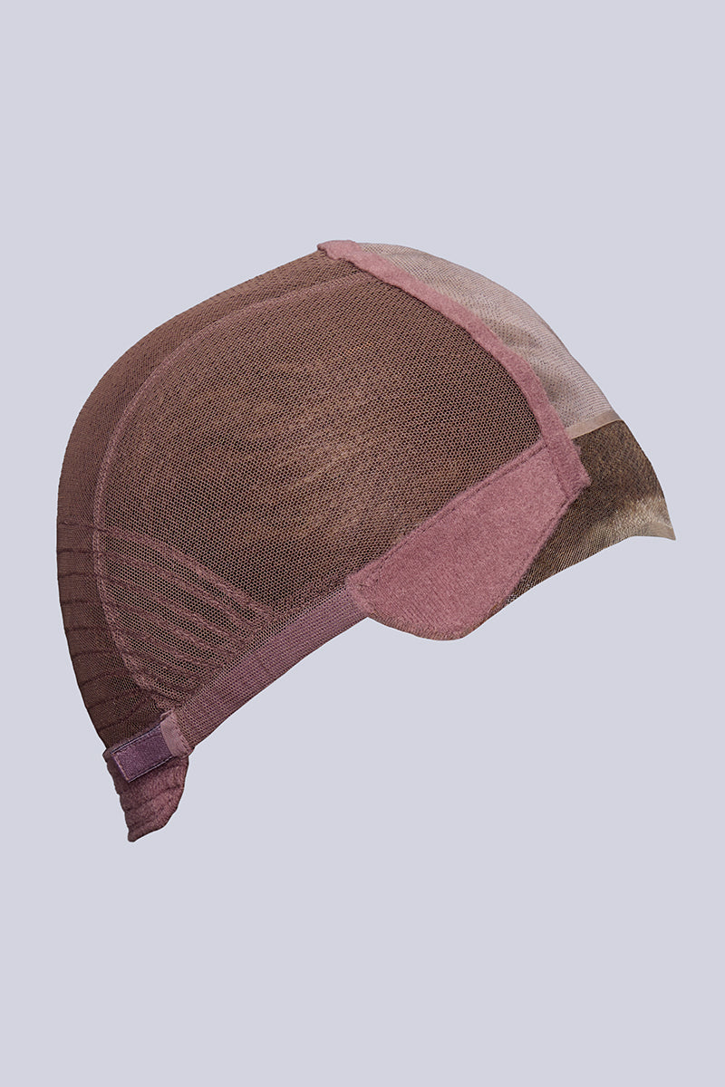 Brown and pink wig cap on a light gray background