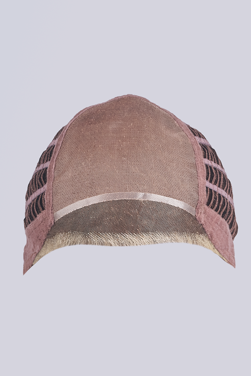 Brown cap with black and white pattern on a light gray background