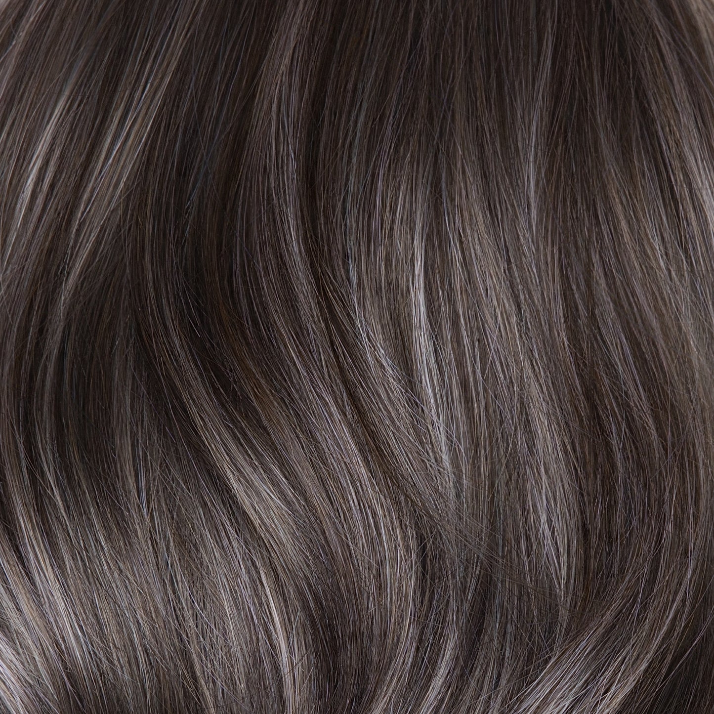 Close-up of dark brown hair with subtle highlights