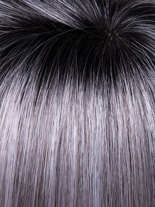 Close-up of gray hair transitioning to black at the roots